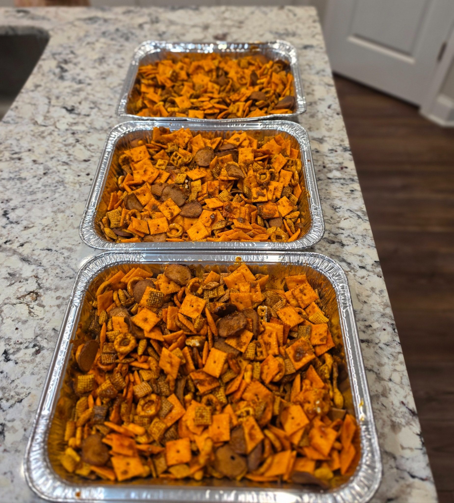 Three pans of Luna & Dad Smokehouse Original Smokehouse smoked snack mix