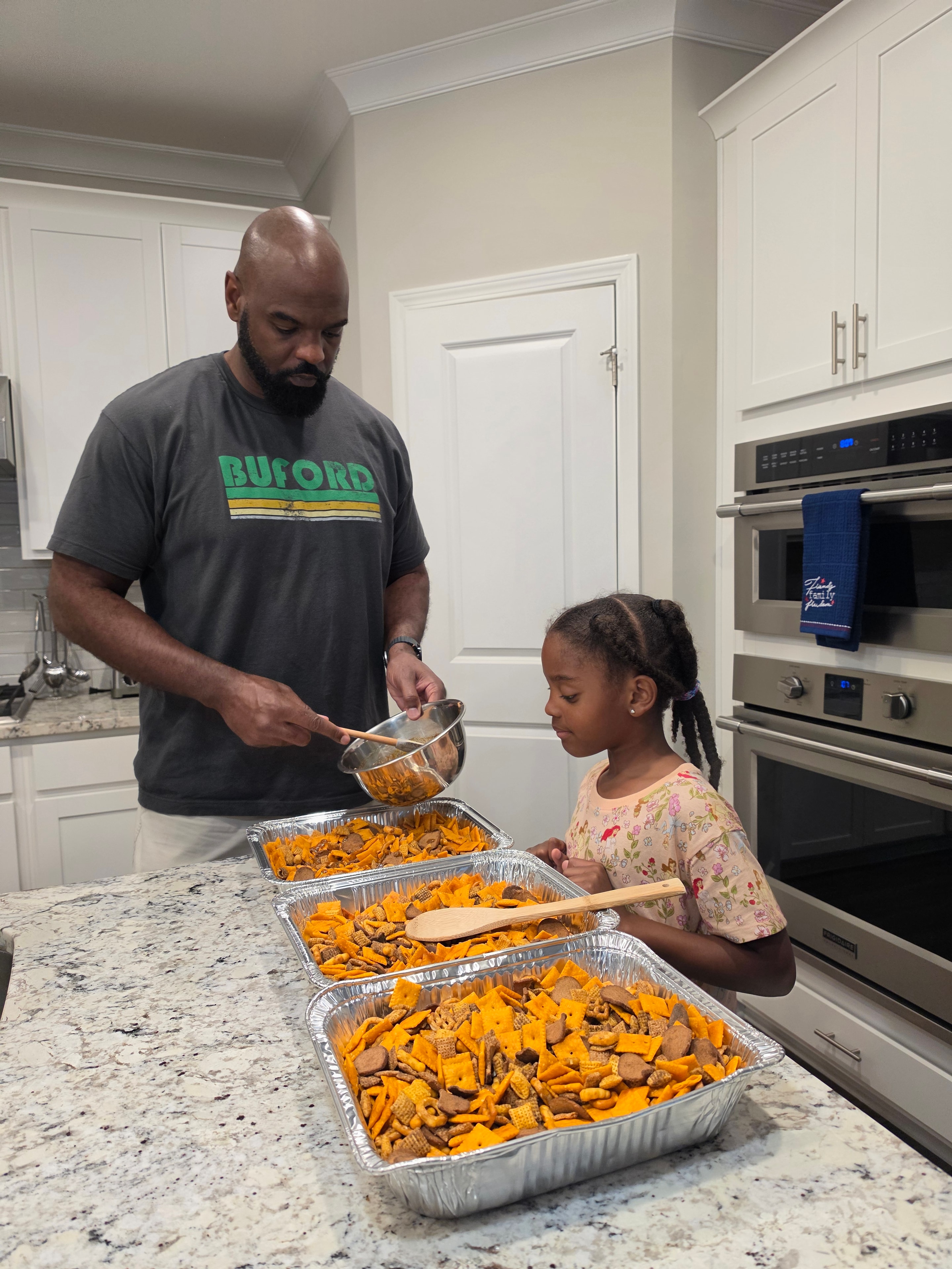 Dad and Luna making their smoked snack mix together